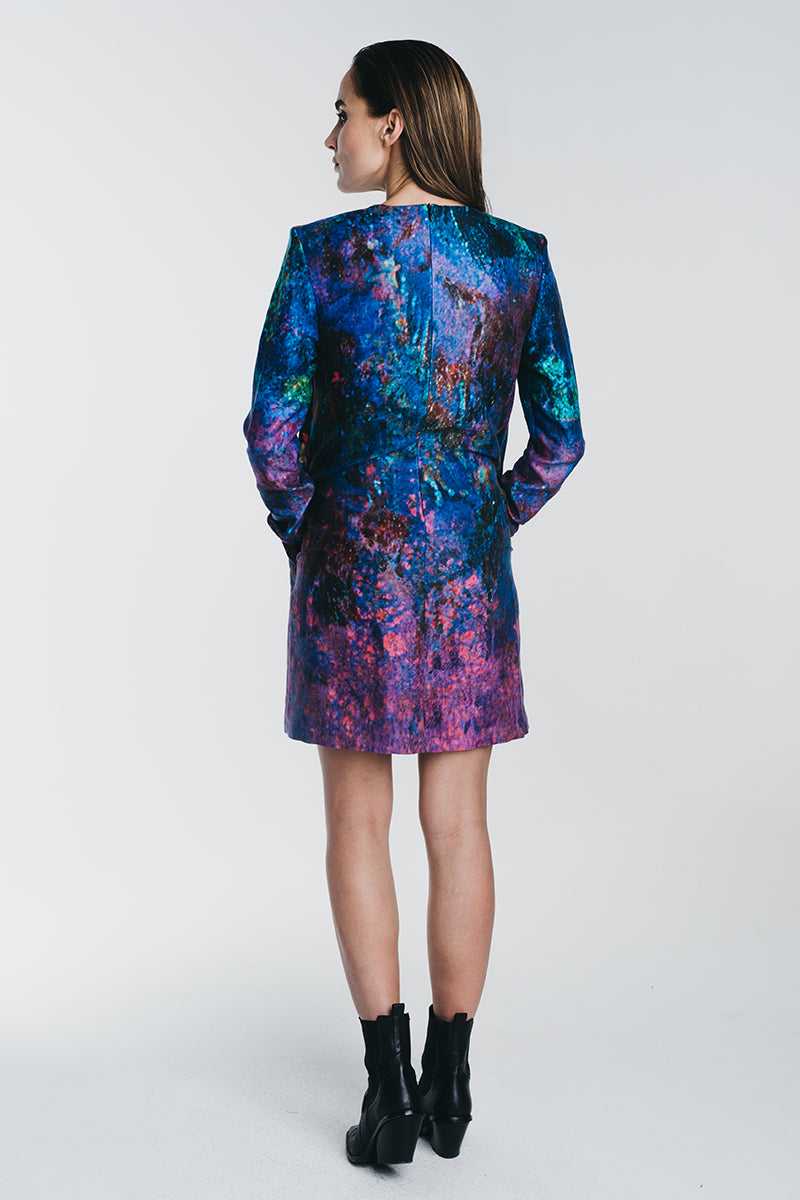 Reidar longsleeved minidress in blue tones. Picture from behind. Hálo x Reidar Särestöniemi EXCLUSIVE